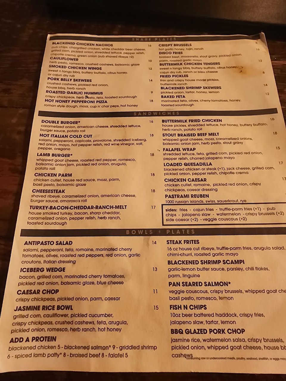 Printed menu with bar snacks and drinks.